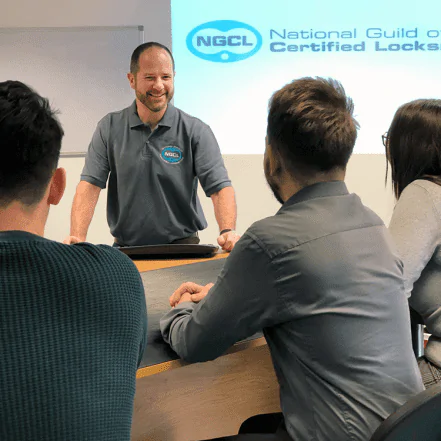 ngcl members sat round table with teacher